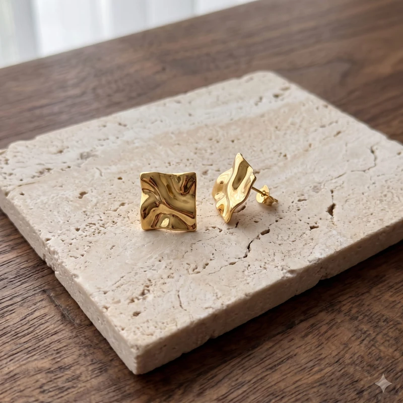 Gold_stud_earrings_with_a_202606241055.jpeg