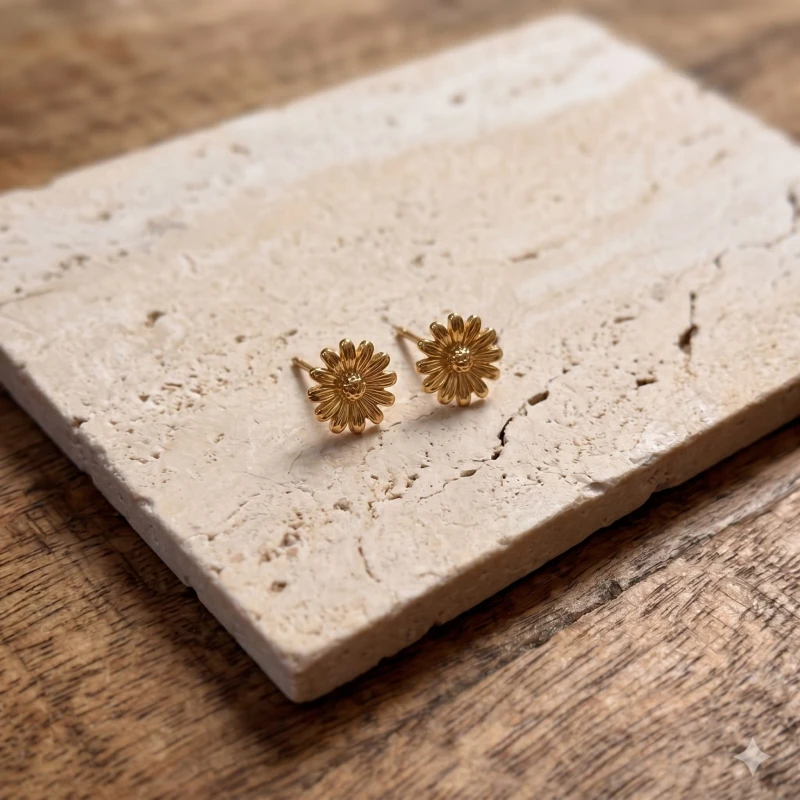 Small_golden_flower-shaped_earrings_resting_202606241116.jpeg