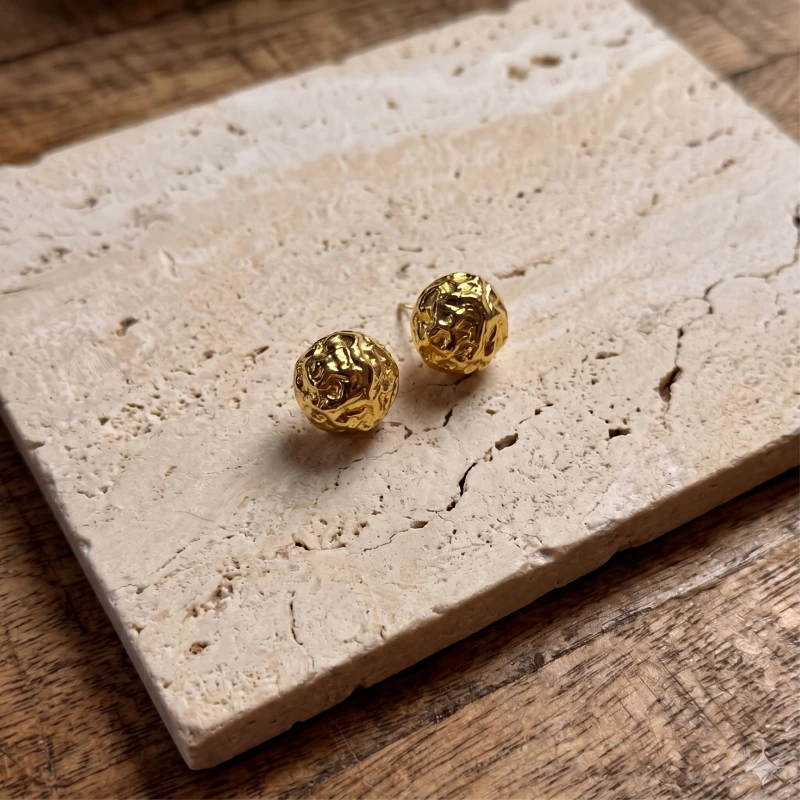 Gold_stud_earrings_with_a_202606241051 (1).jpeg